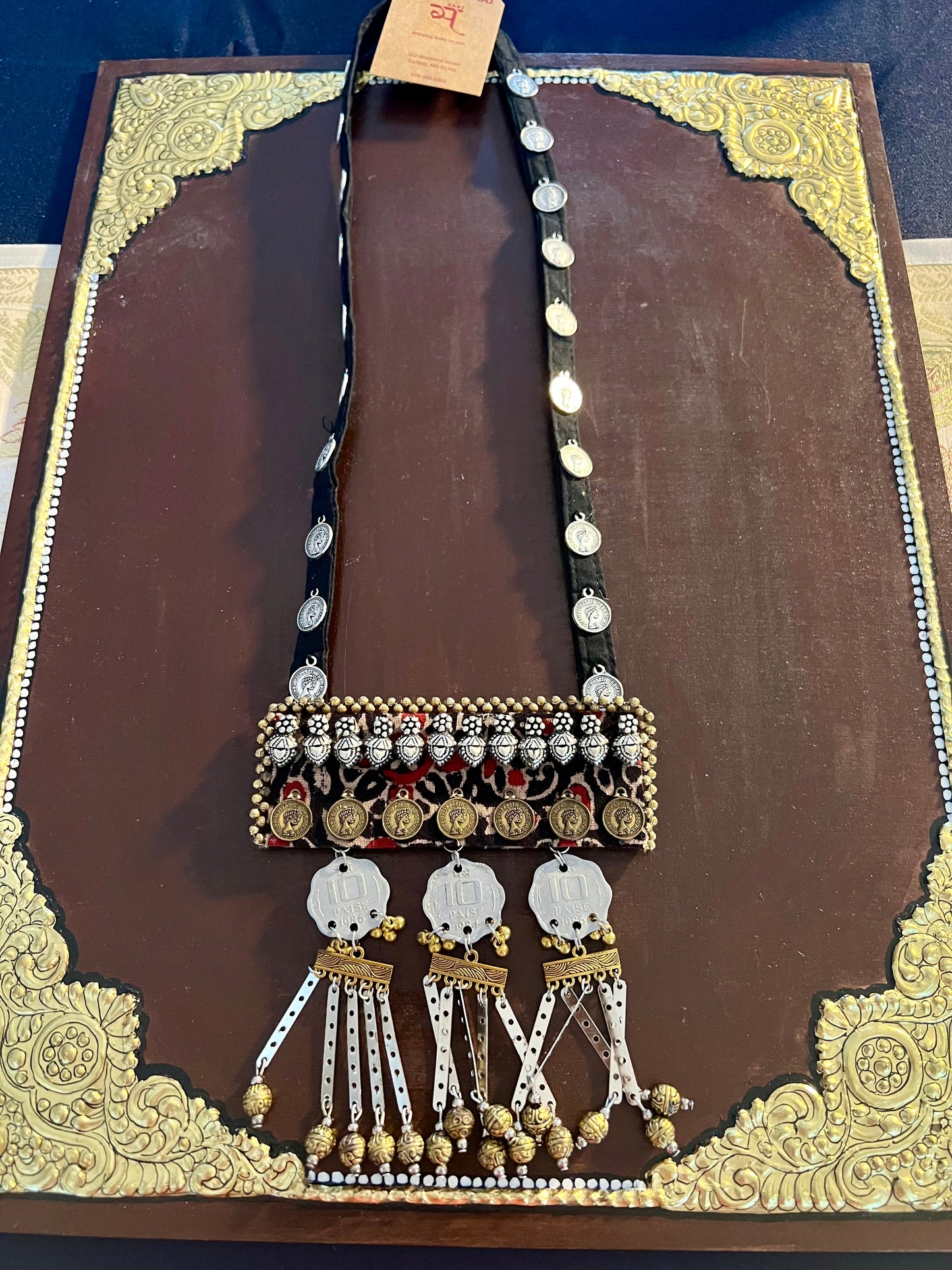 Handcrafted upcycled coin necklaces, featuring unique, vintage coins and intricate detailing, offering a blend of sustainability and timeless style.