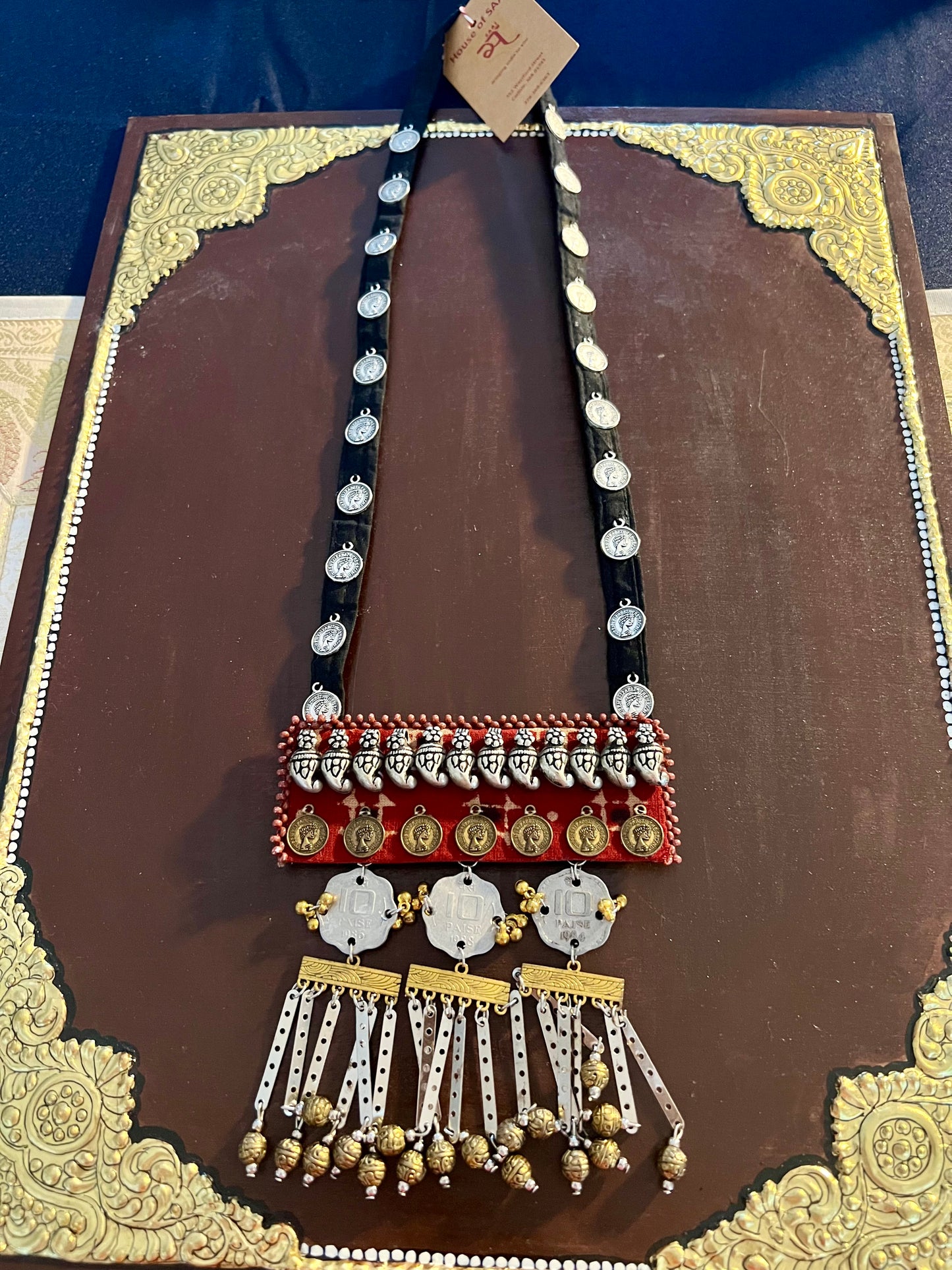 Handcrafted upcycled coin necklaces, featuring unique, vintage coins and intricate detailing, offering a blend of sustainability and timeless style.