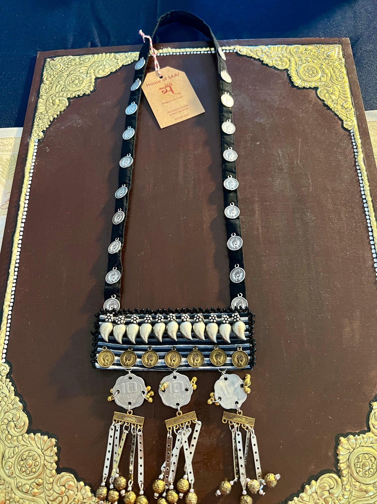 Handcrafted upcycled coin necklaces, featuring unique, vintage coins and intricate detailing, offering a blend of sustainability and timeless style.