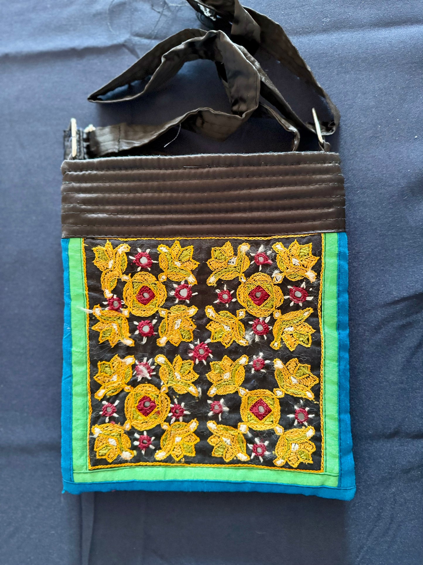 Handcrafted Kutchi embroidery bags and purses featuring intricate needlework, vibrant patterns, and traditional Indian craftsmanship.