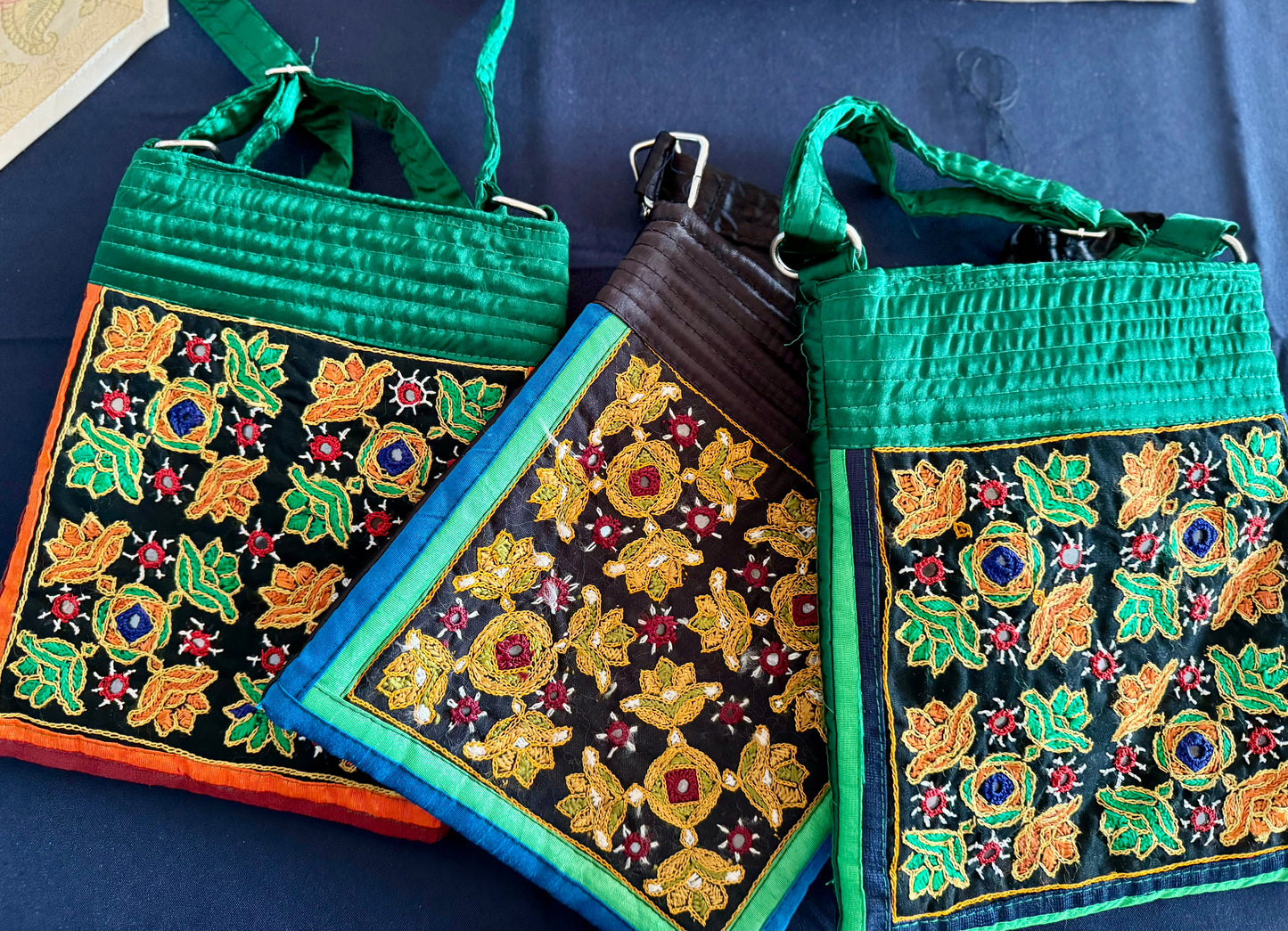 Handcrafted Kutchi embroidery bags and purses featuring intricate needlework, vibrant patterns, and traditional Indian craftsmanship.