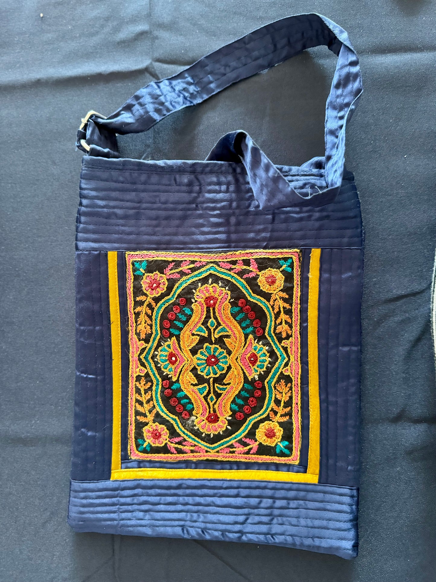 Handcrafted Kutchi embroidery bags and purses featuring intricate needlework, vibrant patterns, and traditional Indian craftsmanship.