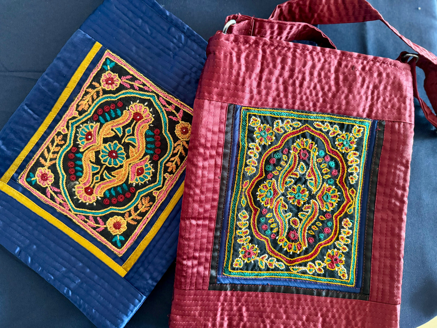 Handcrafted Kutchi embroidery bags and purses featuring intricate needlework, vibrant patterns, and traditional Indian craftsmanship.
