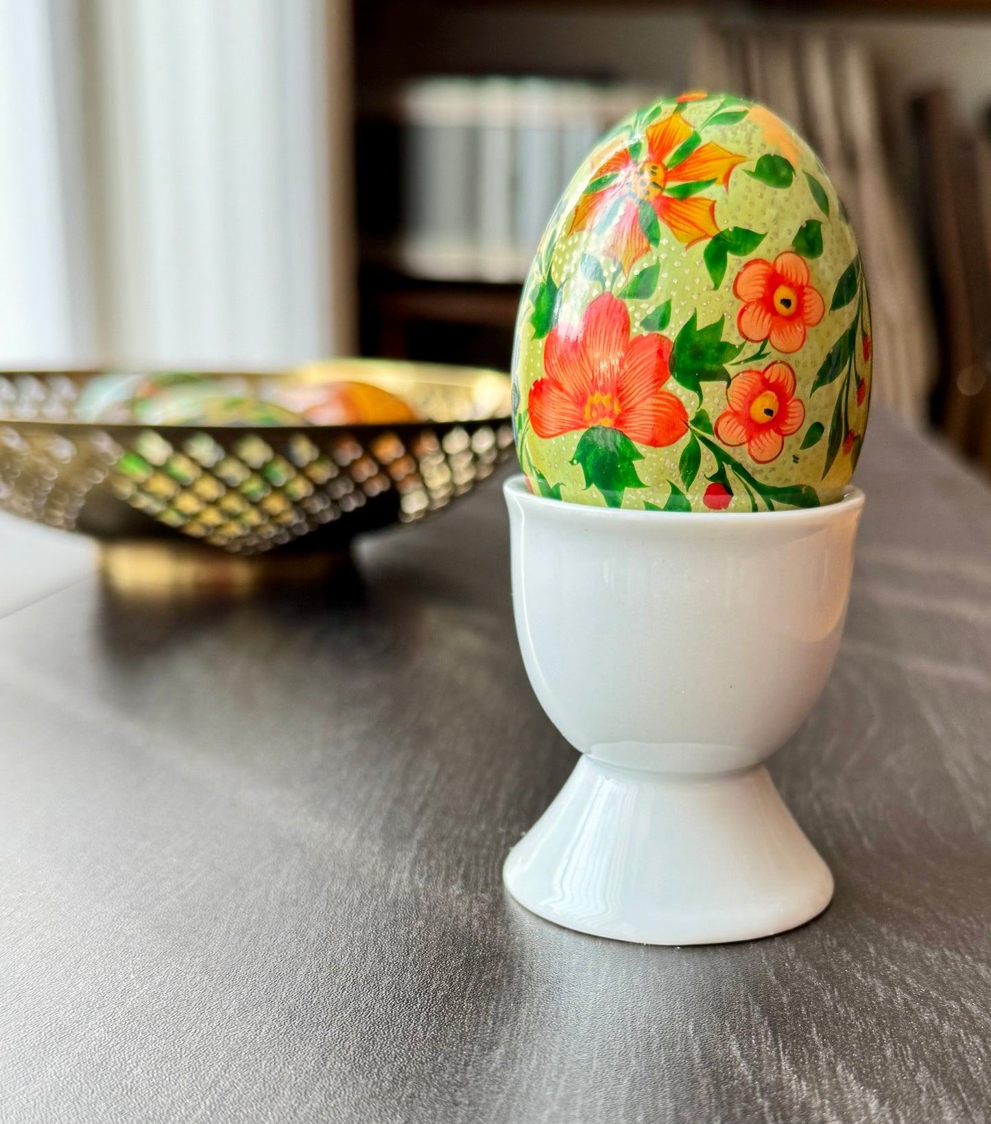 Handcrafted Kashmiri papier-mâché Easter eggs, intricately painted with traditional motifs and vibrant colors. A unique blend of heritage and artistry, perfect for adding cultural charm to your festive decor.