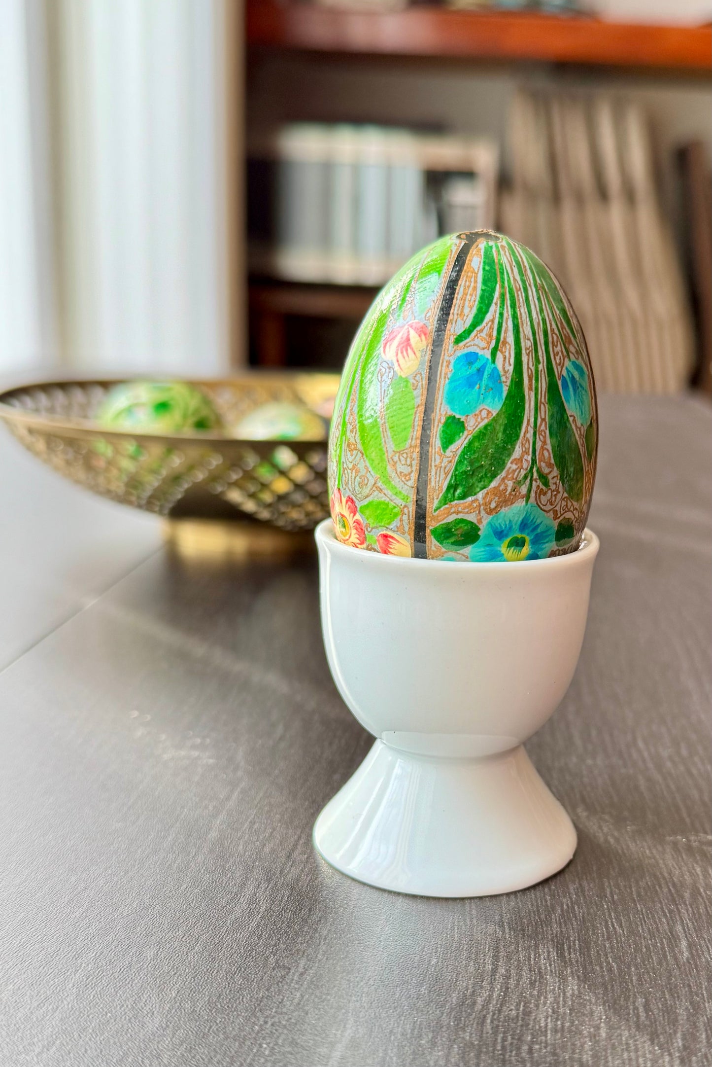 Handcrafted Kashmiri papier-mâché Easter eggs, intricately painted with traditional motifs and vibrant colors. A unique blend of heritage and artistry, perfect for adding cultural charm to your festive decor.