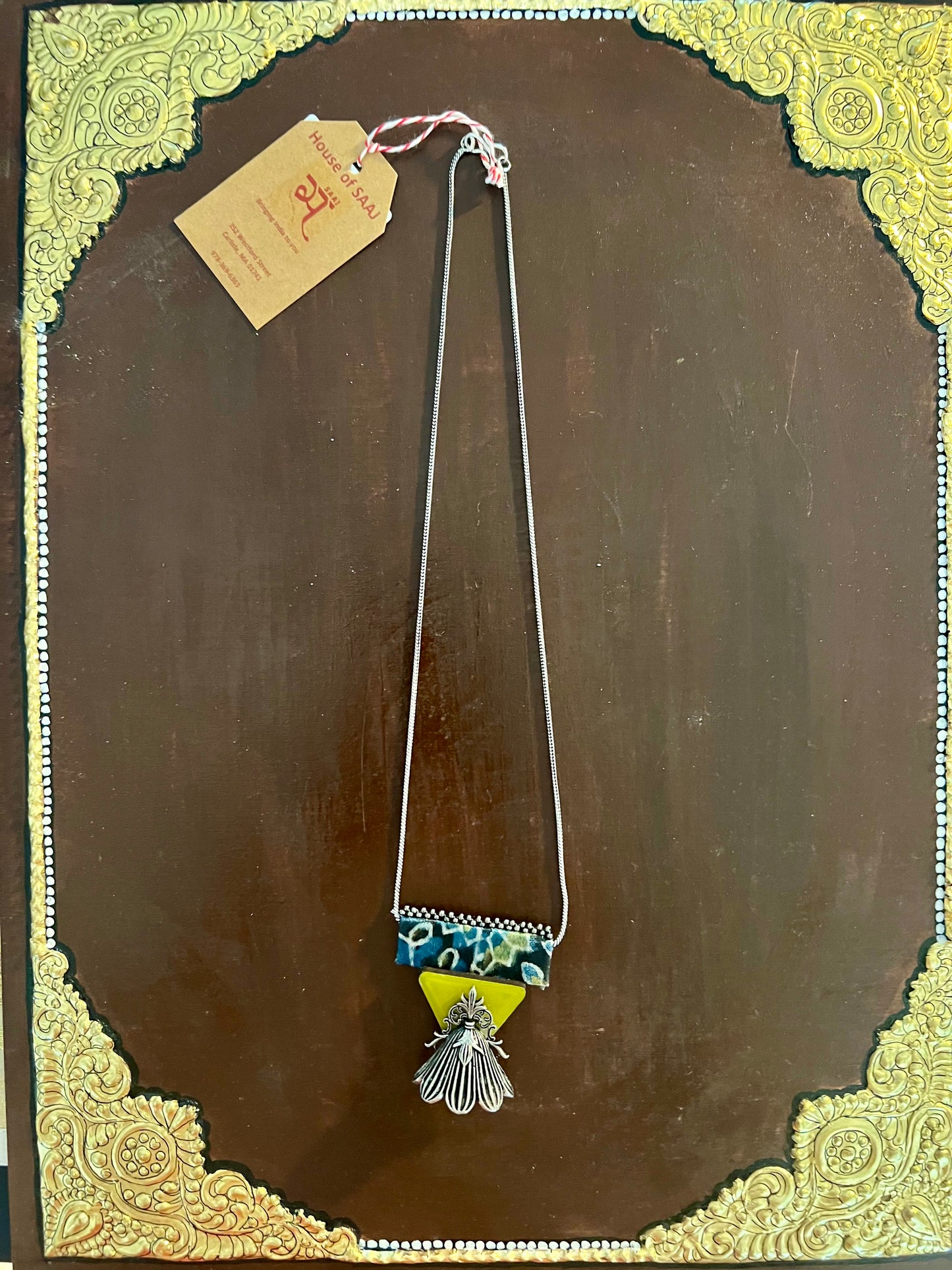 Eco-friendly upcycled handmade small-sized pendant necklaces, featuring delicate designs and sustainable materials, offering a subtle and stylish accessory.