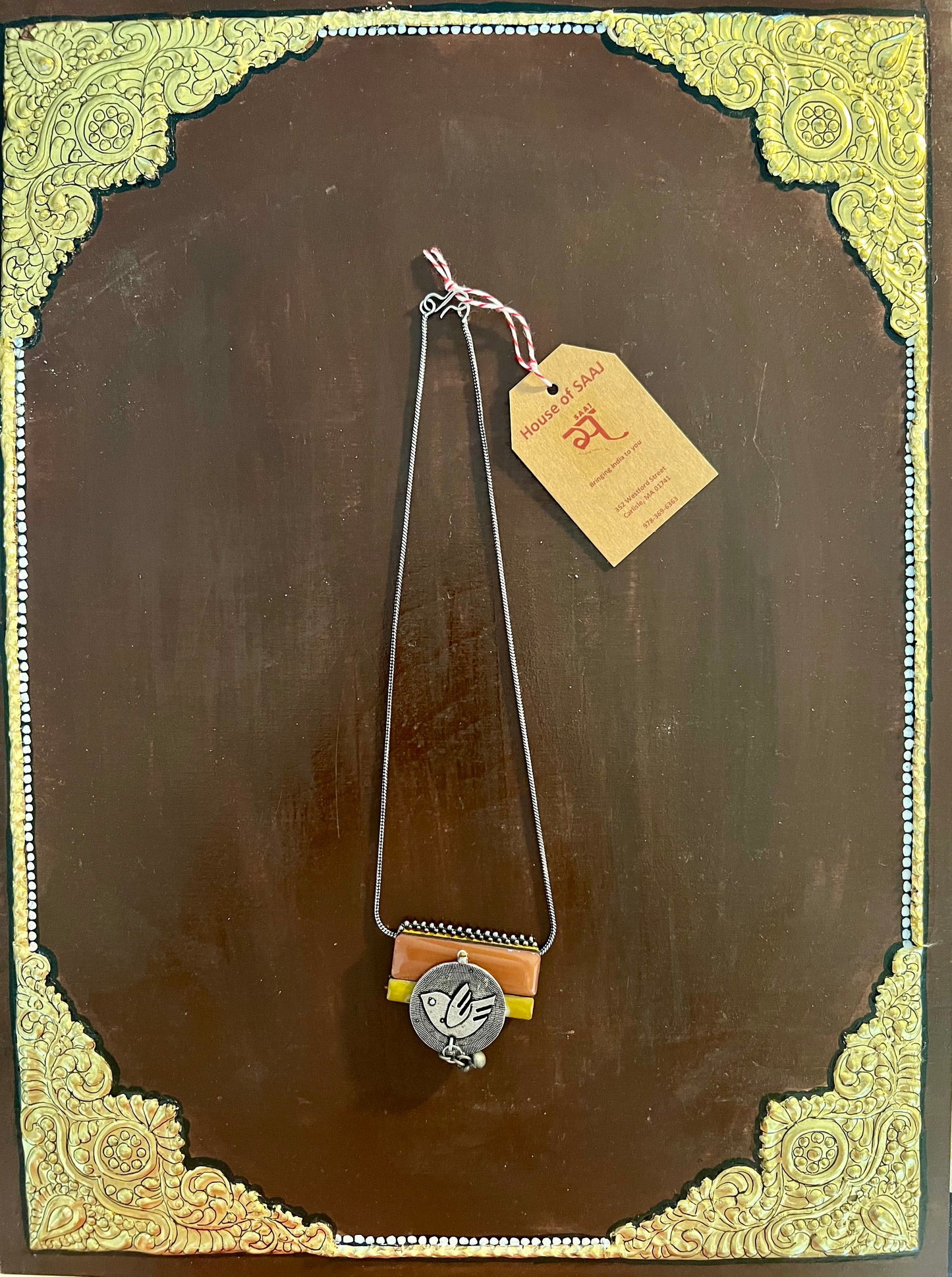 Eco-friendly upcycled handmade small-sized pendant necklaces, featuring delicate designs and sustainable materials, offering a subtle and stylish accessory.
