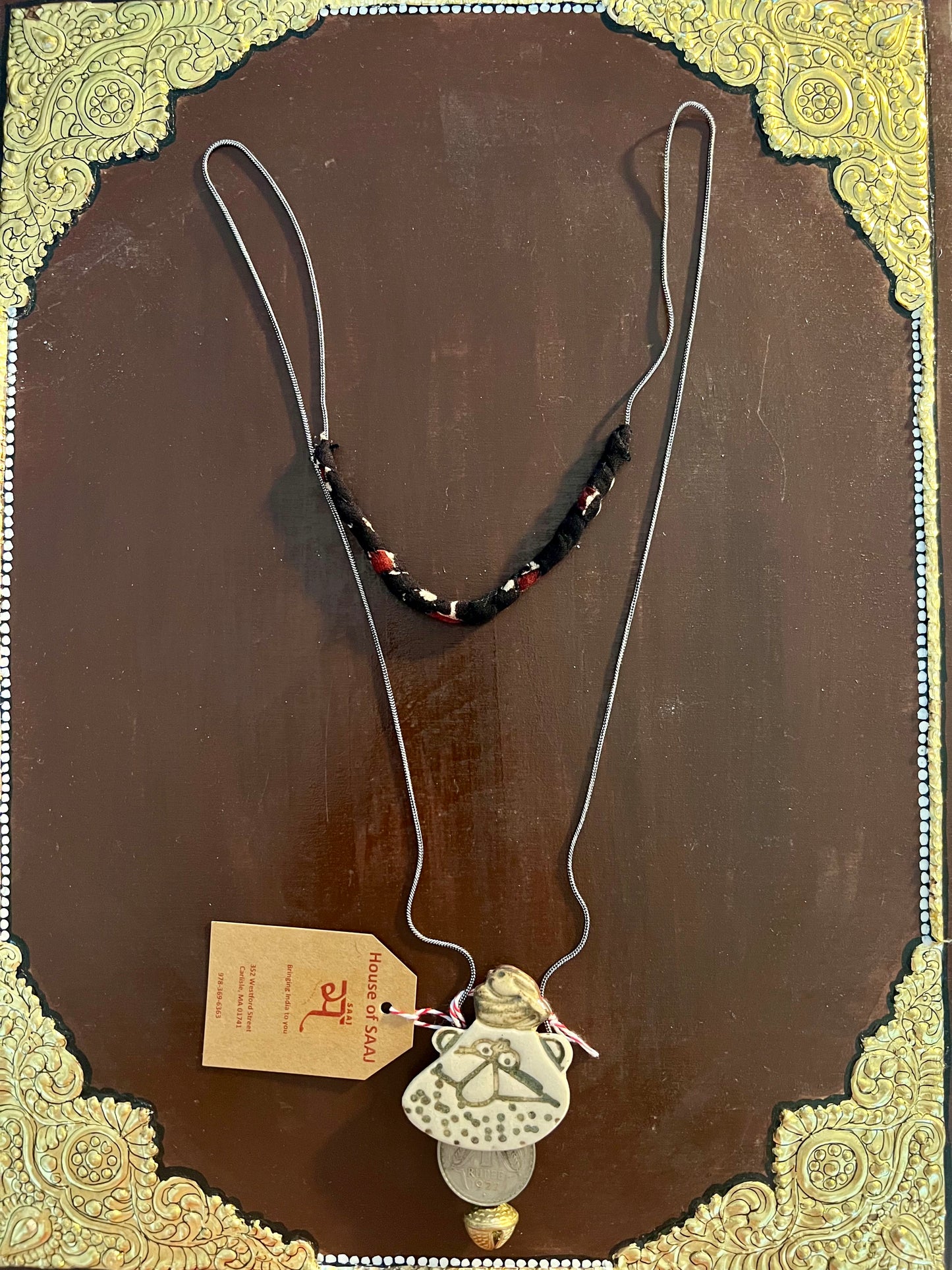 Eco-friendly upcycled handmade small-sized pendant necklaces, featuring delicate designs and sustainable materials, offering a subtle and stylish accessory.