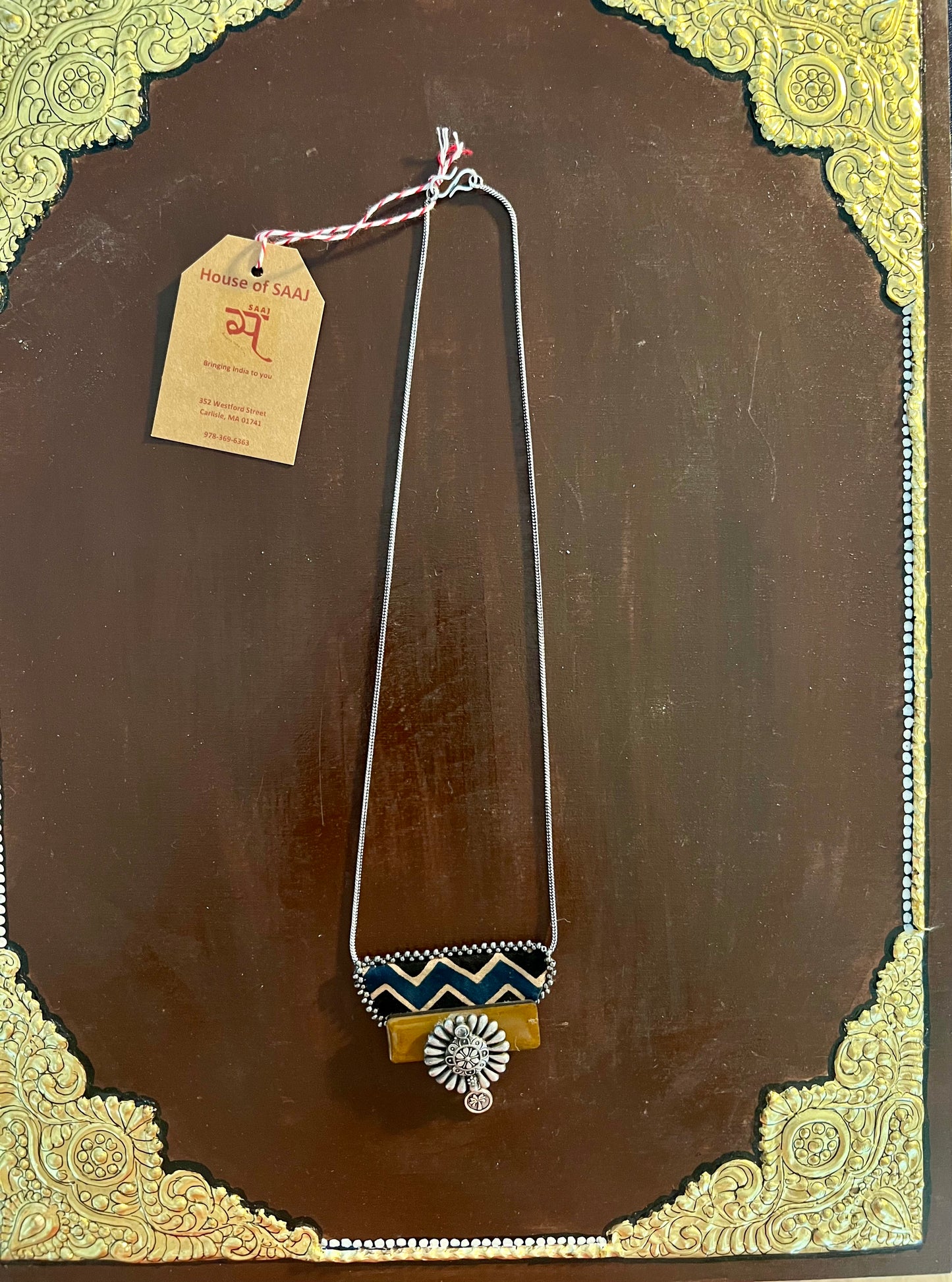Eco-friendly upcycled handmade small-sized pendant necklaces, featuring delicate designs and sustainable materials, offering a subtle and stylish accessory.