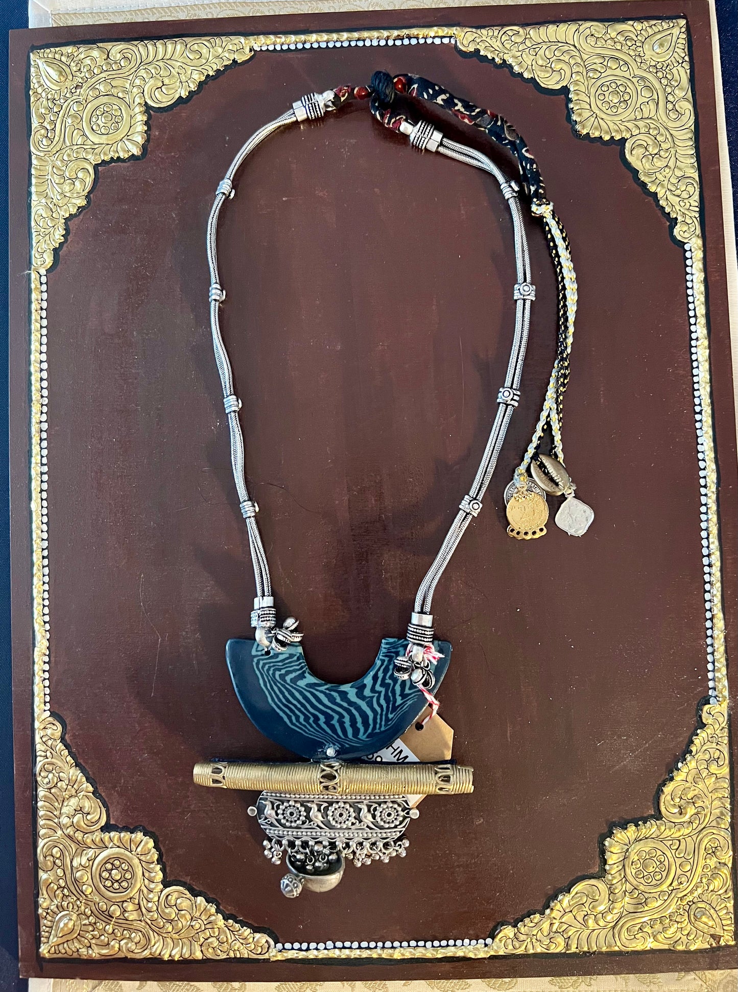 Eco-friendly upcycled handmade large pendant necklaces, featuring bold designs and unique materials, combining sustainability with striking craftsmanship.