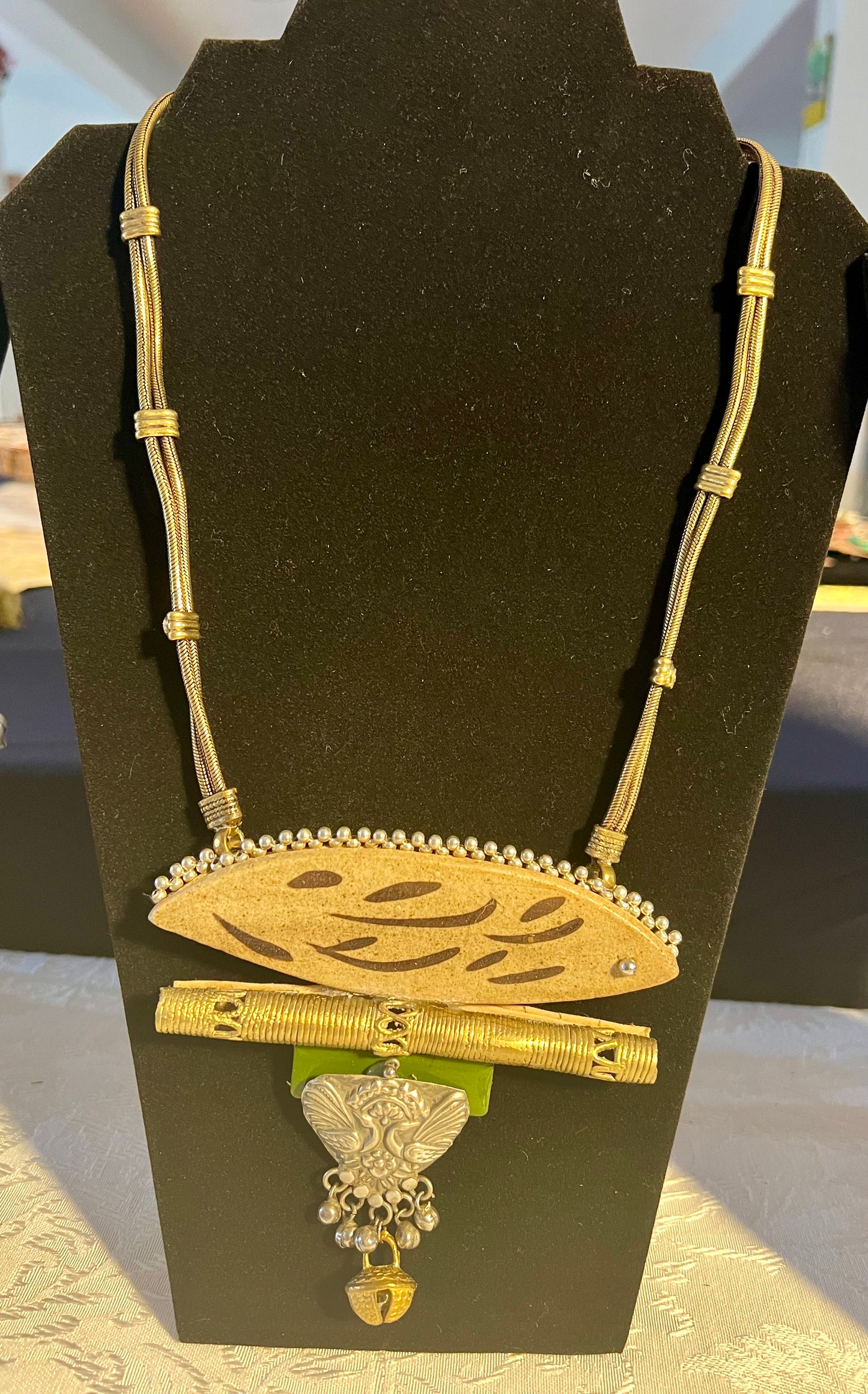 Eco-friendly upcycled handmade large pendant necklaces, featuring bold designs and unique materials, combining sustainability with striking craftsmanship.
