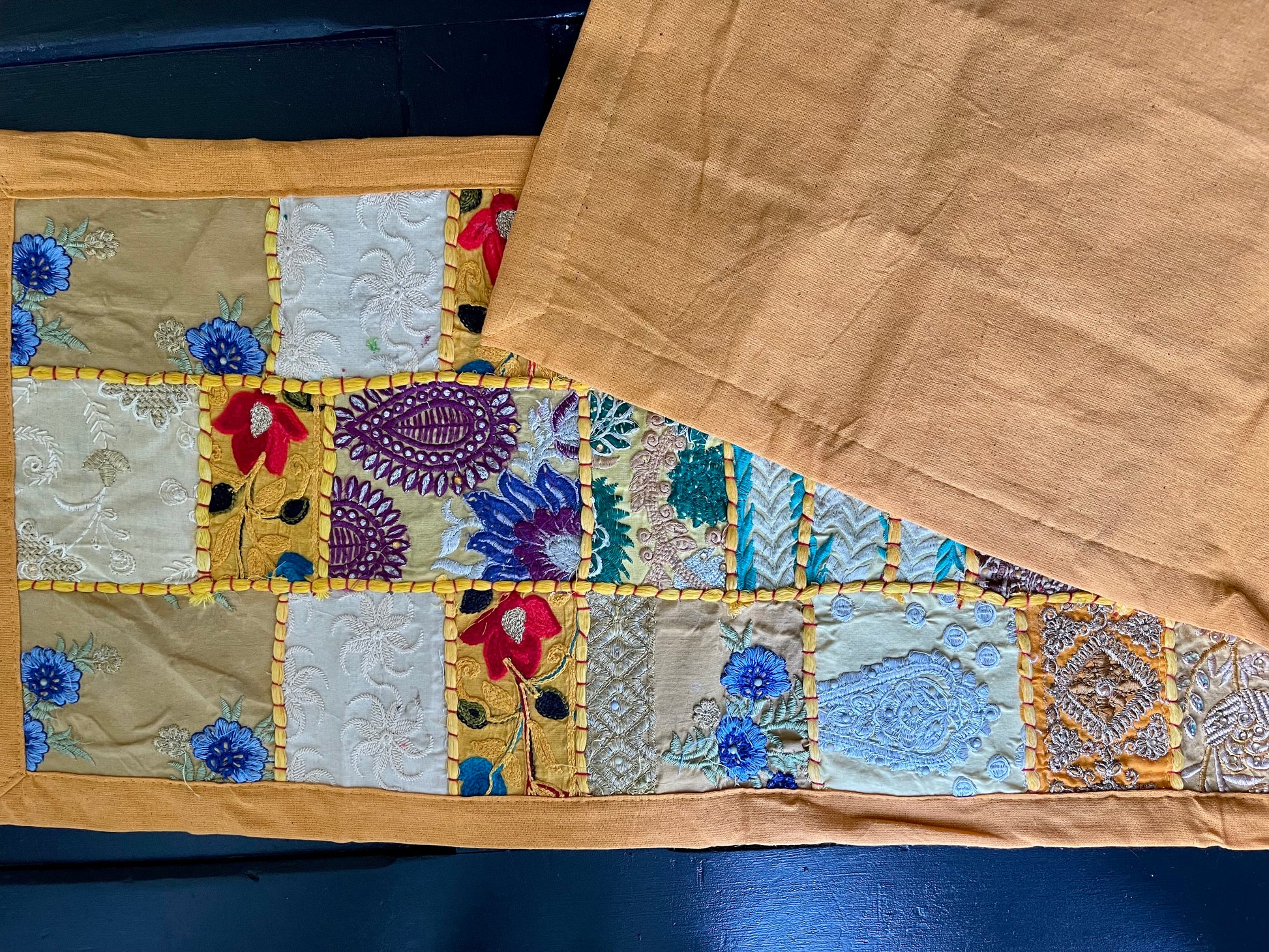 Handwoven Kutchi Khambhadia work table runners, featuring vibrant patchwork and intricate embroidery, adding a touch of traditional Indian craftsmanship to your table.