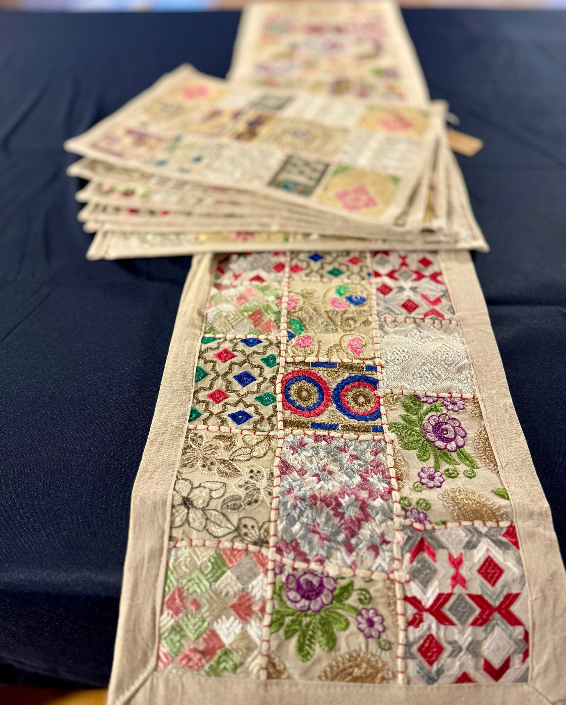 Handwoven Kutchi Khambhadia work table runners, featuring vibrant patchwork and intricate embroidery, adding a touch of traditional Indian craftsmanship to your table.