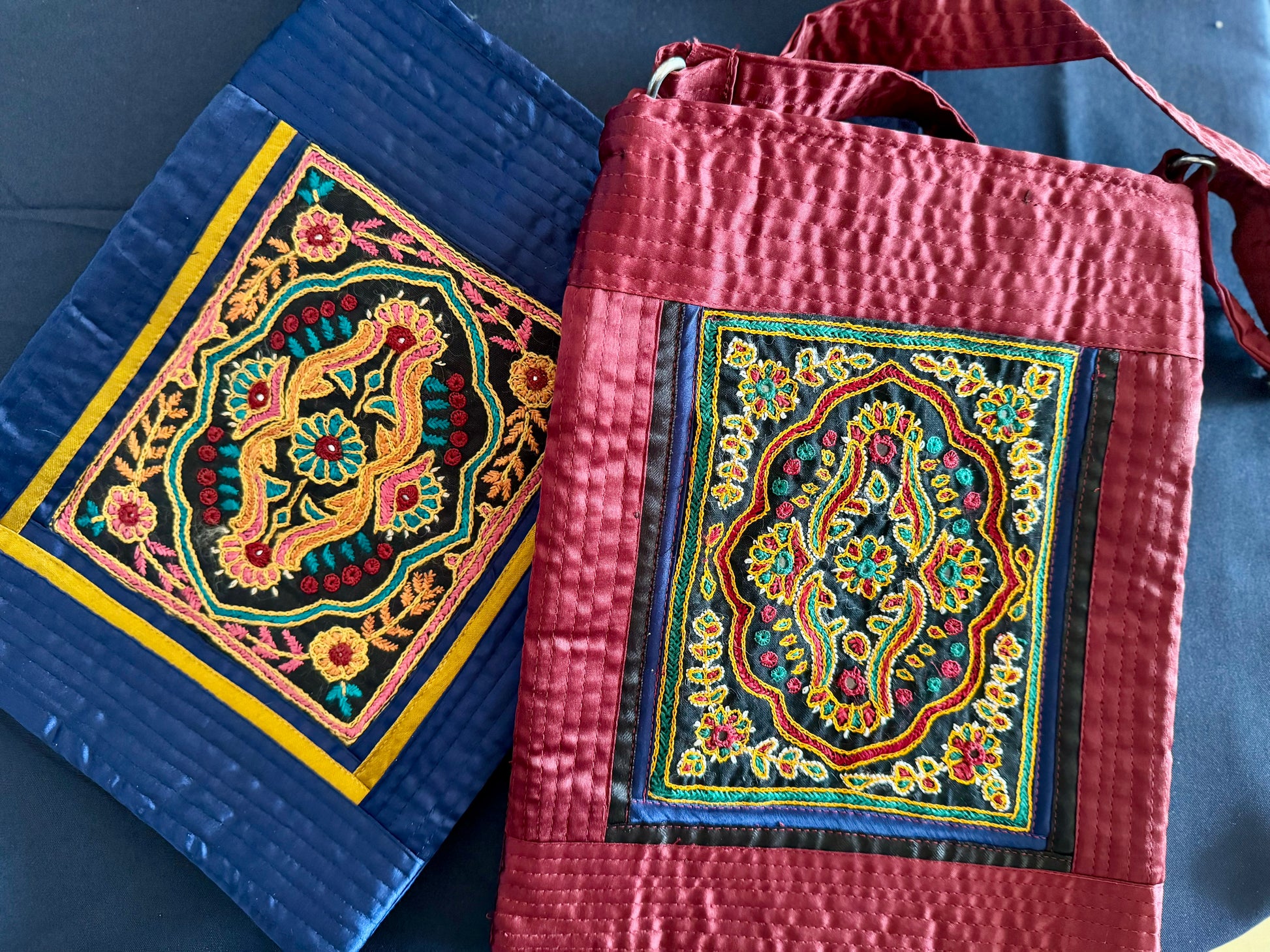 Handcrafted Kutchi embroidery bags and purses featuring intricate needlework, vibrant patterns, and traditional Indian craftsmanship.