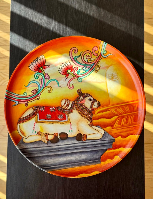 Hand-painted Kerala Mural art wall decor plate featuring intricate traditional motifs and vibrant colors, inspired by ancient temple murals of Kerala. A perfect blend of heritage and craftsmanship for your home.