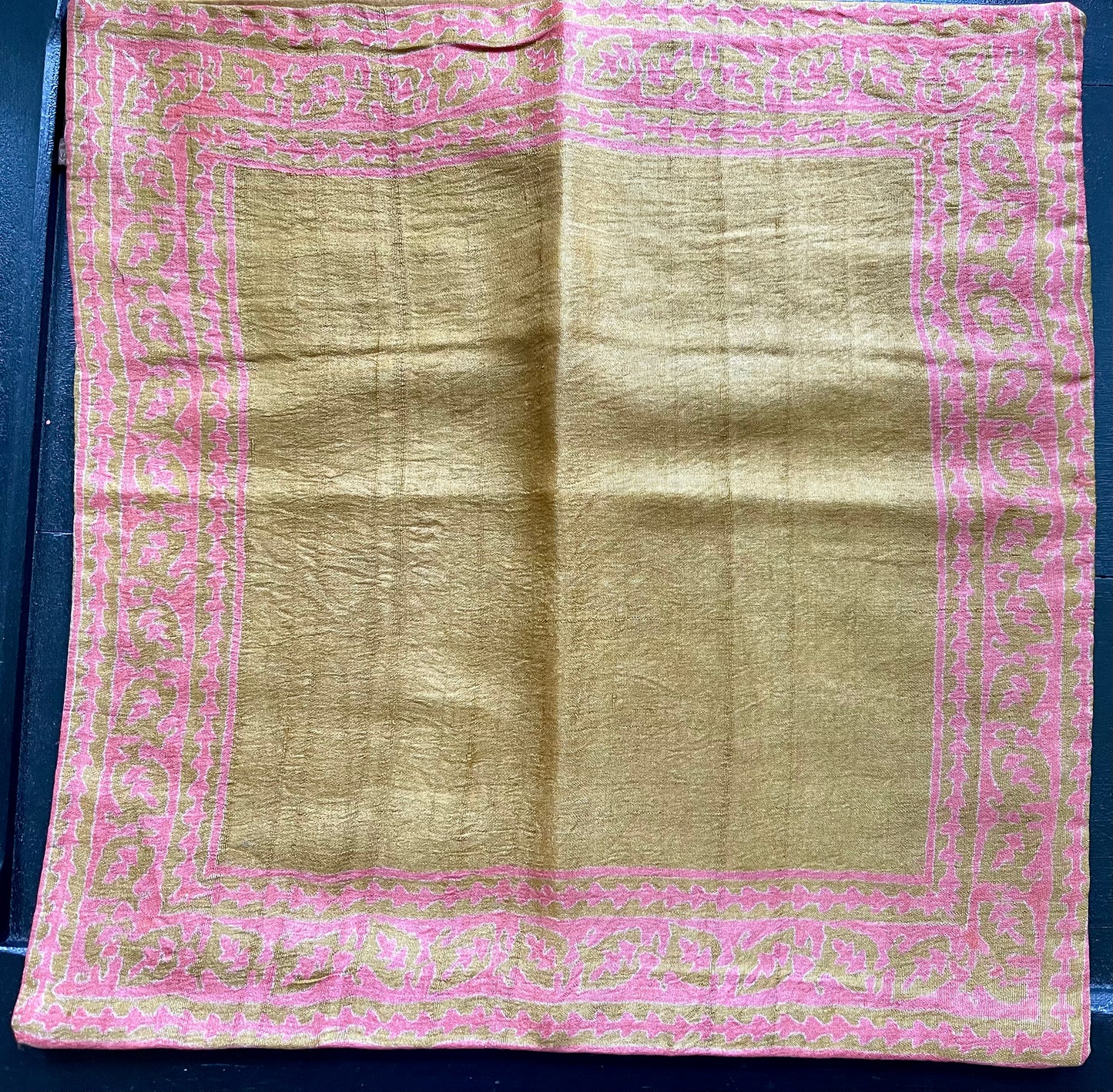 Elegant raw silk hand block print cushion covers, featuring intricate patterns and rich colors, combining traditional craftsmanship with luxurious texture.
