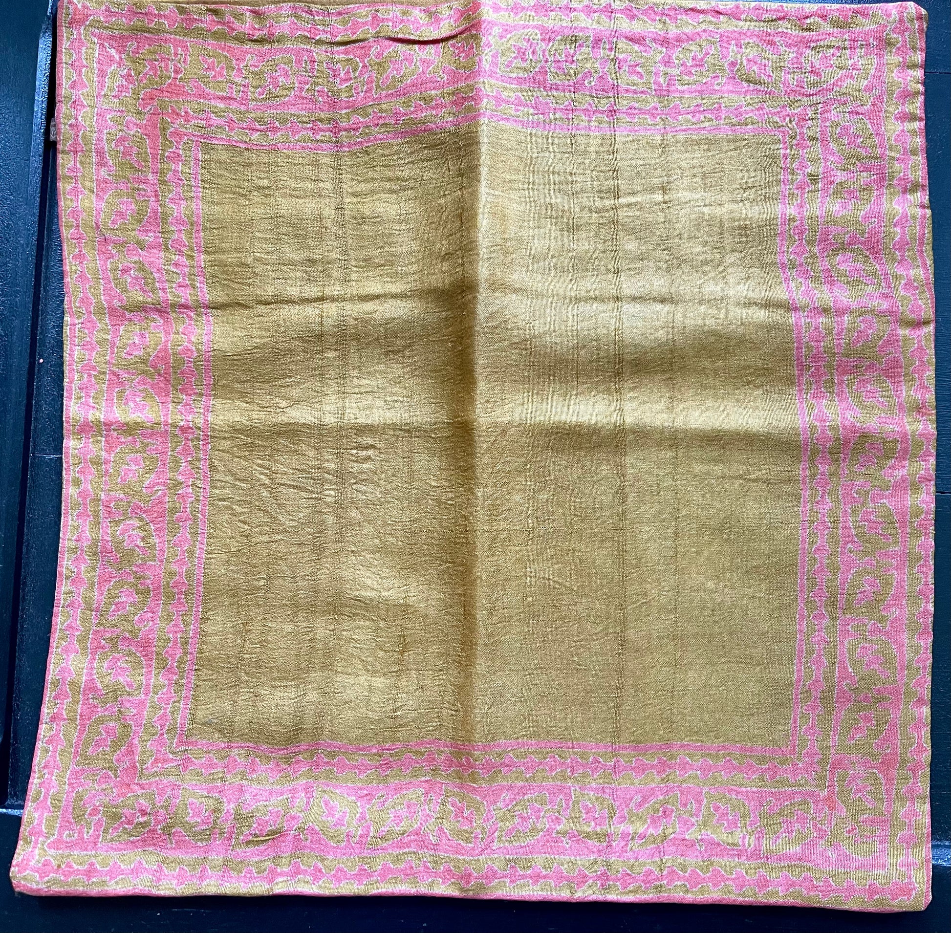 Elegant raw silk hand block print cushion covers, featuring intricate patterns and rich colors, combining traditional craftsmanship with luxurious texture.