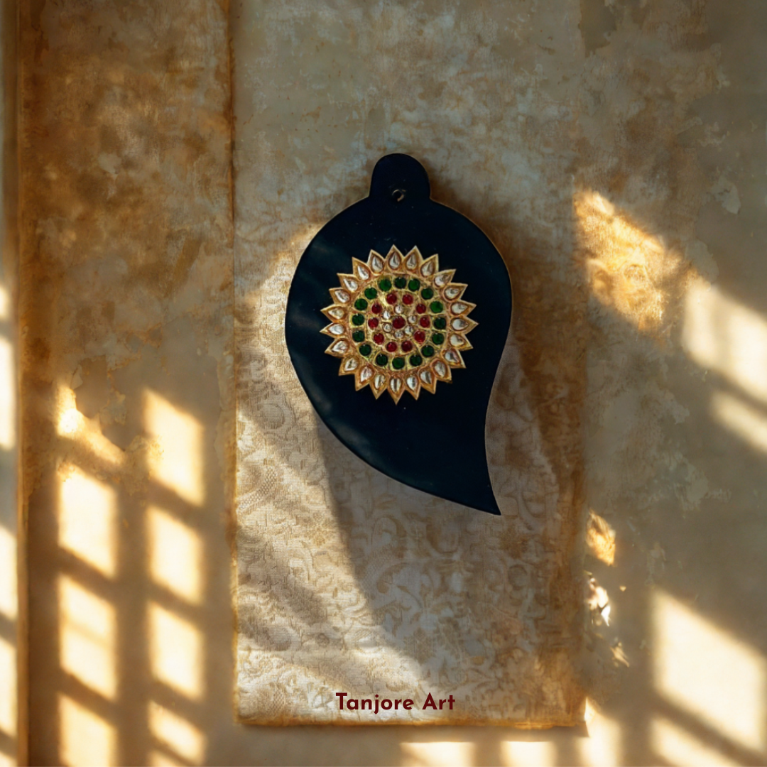 Handcrafted Tanjore art on functional items, such as trays, boxes, and wall hangings, featuring vibrant colors and intricate detailing. A beautiful fusion of traditional craftsmanship and practical elegance for your home.