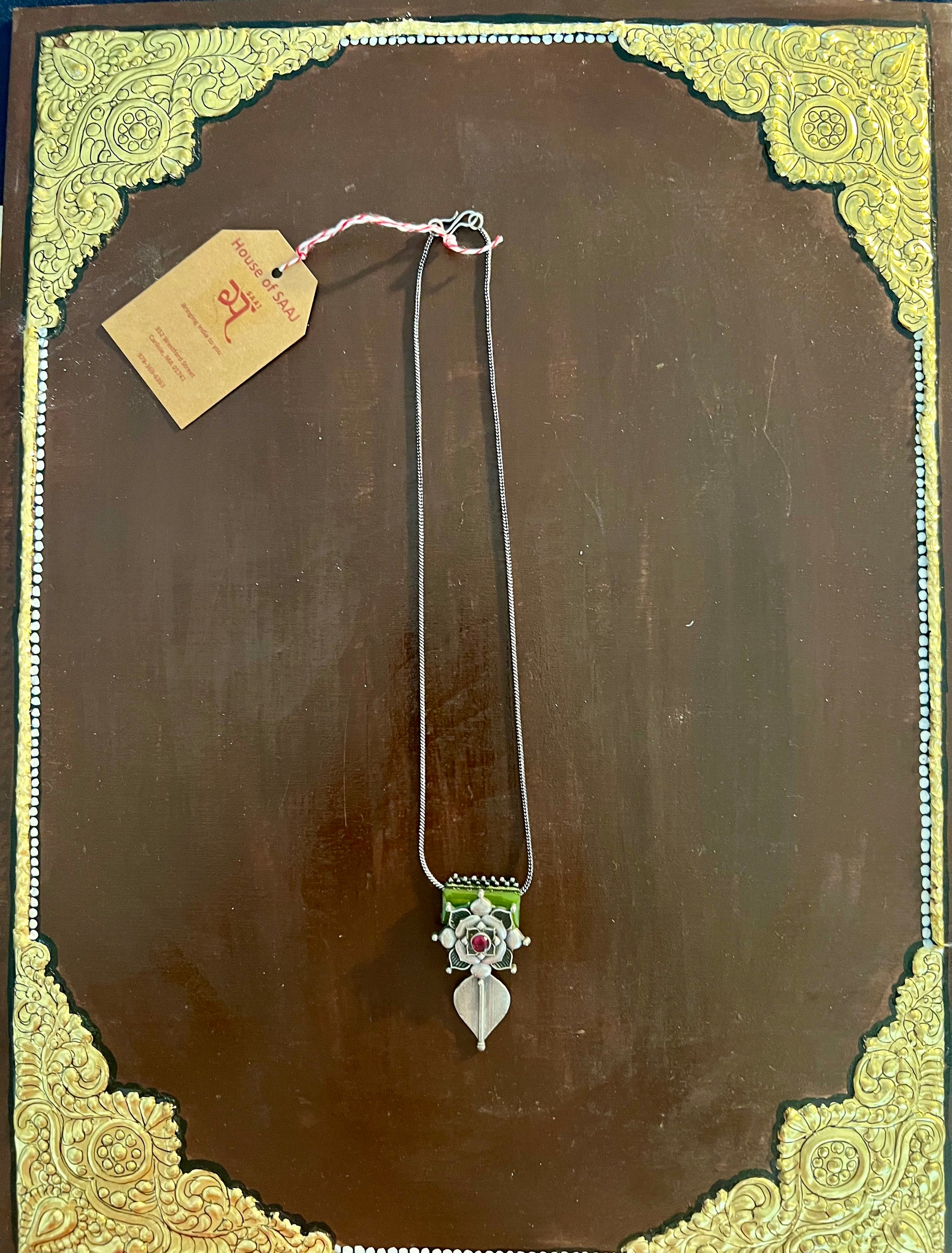Eco-friendly upcycled handmade small-sized pendant necklaces, featuring delicate designs and sustainable materials, offering a subtle and stylish accessory.